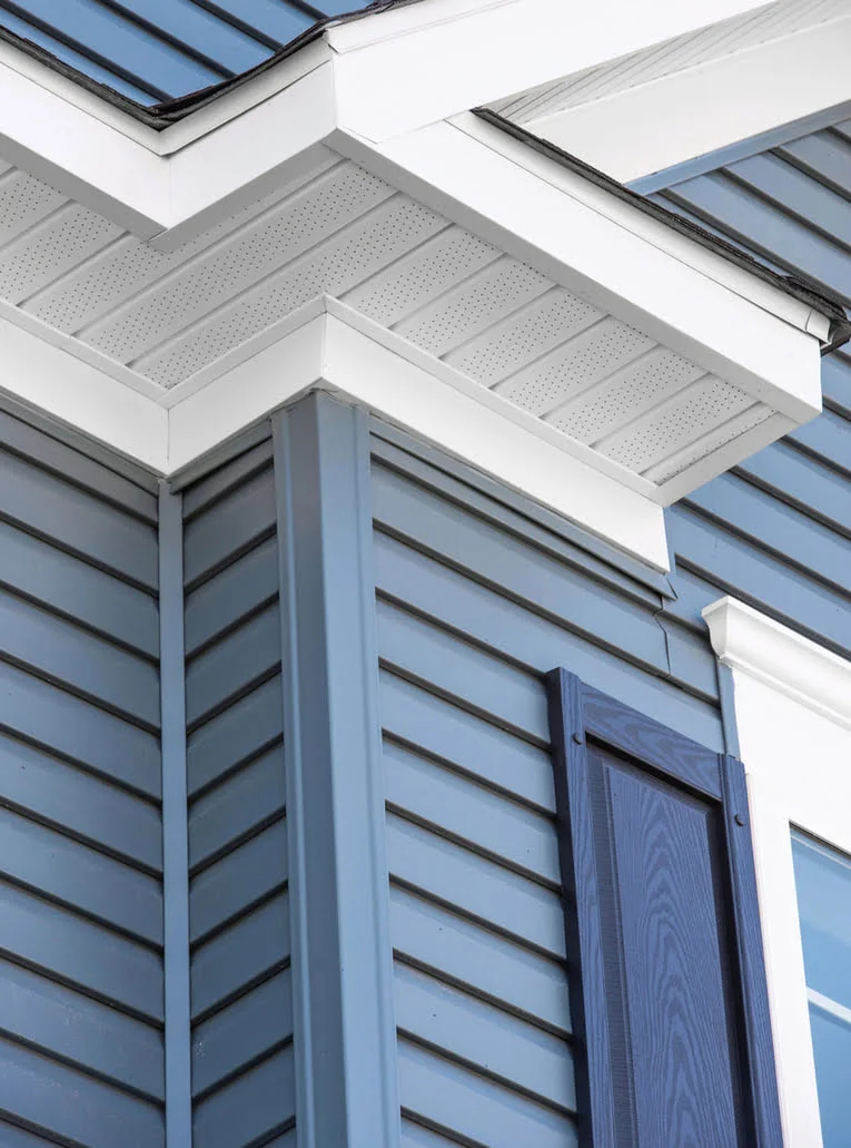 Blue vinyl siding installed on a beach front cottage