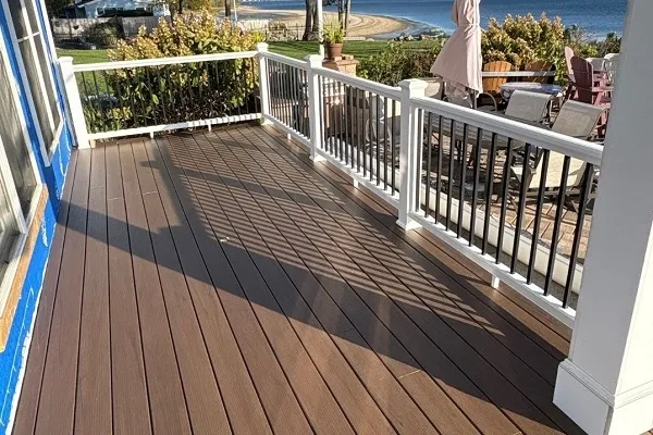 Deck Building and Repair servicing all of Rhode Island. Photo showing composite decking installing