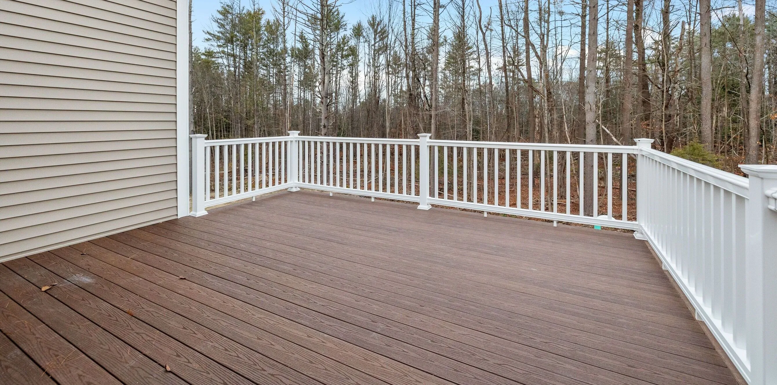 Deck Building and Repair servicing all of Rhode Island. Photo showing composite decking installing